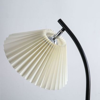 Ozawa floor lamp detail: pleated fabric shade and black arc metal