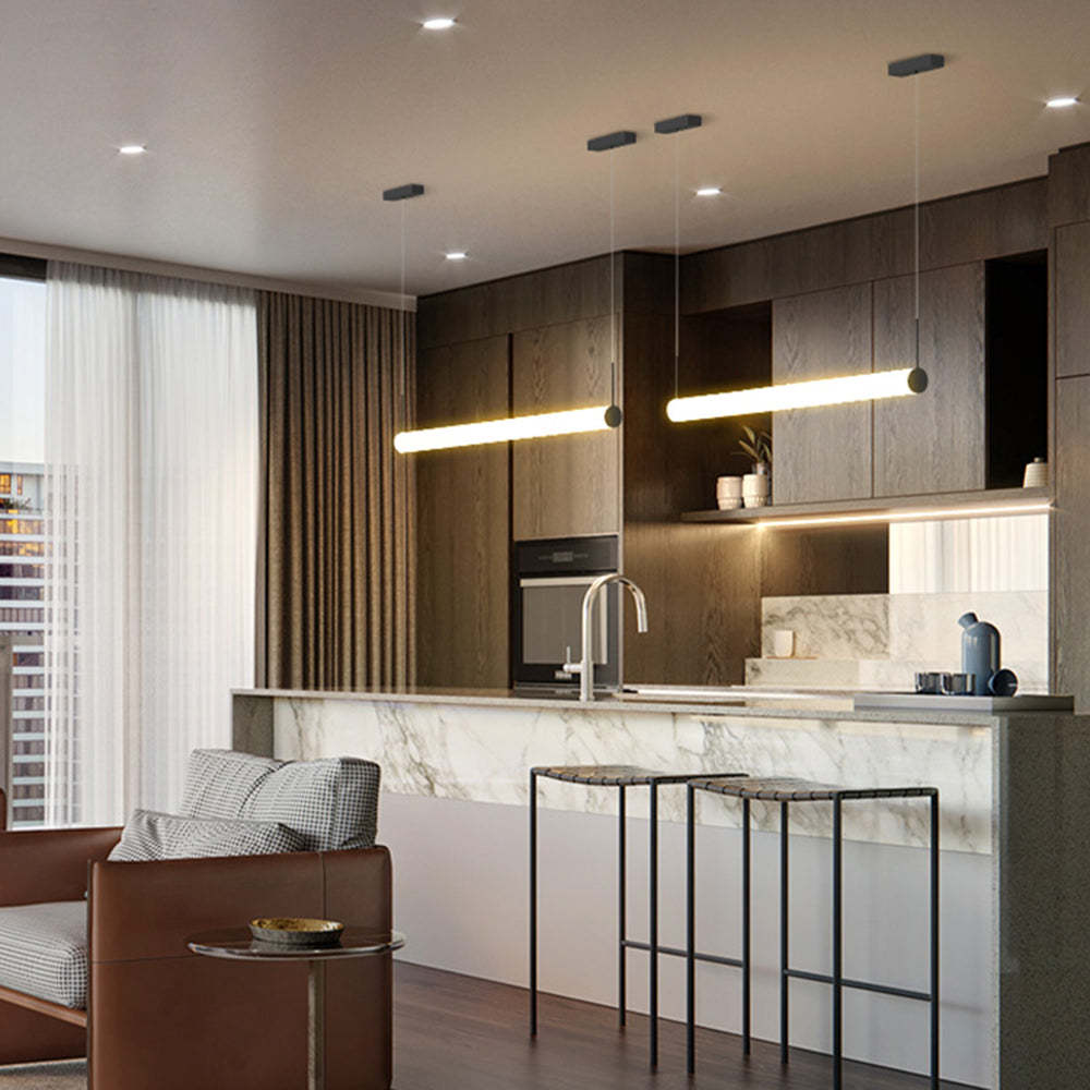 Modern kitchen with cylinder pendant lights.