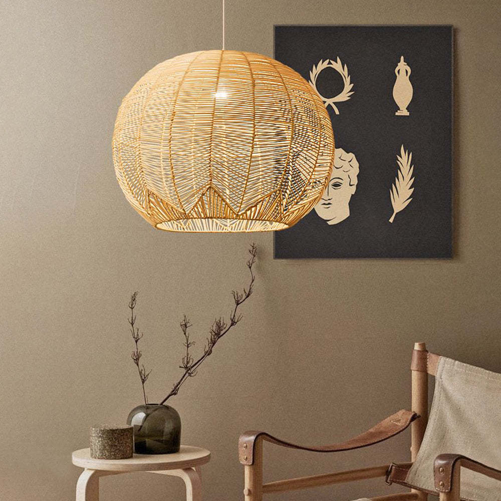 Ritta rattan pendant light in a styled room setting.