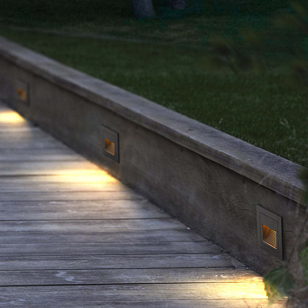 Orr deck step lights illuminating wooden deck