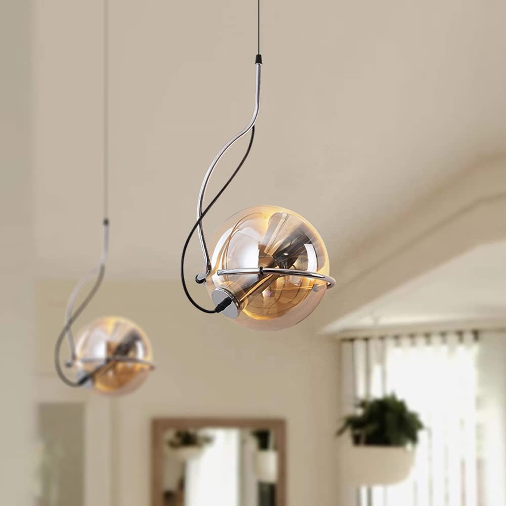 Amber glass pendant light with metal accents, modern interior lighting