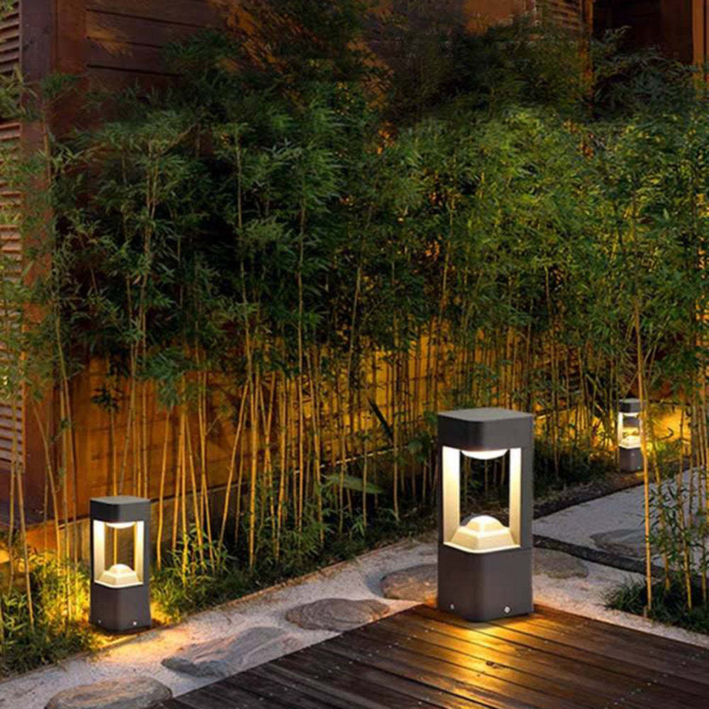 Pena Outdoor Path Light - Warm light illuminating bamboo garden