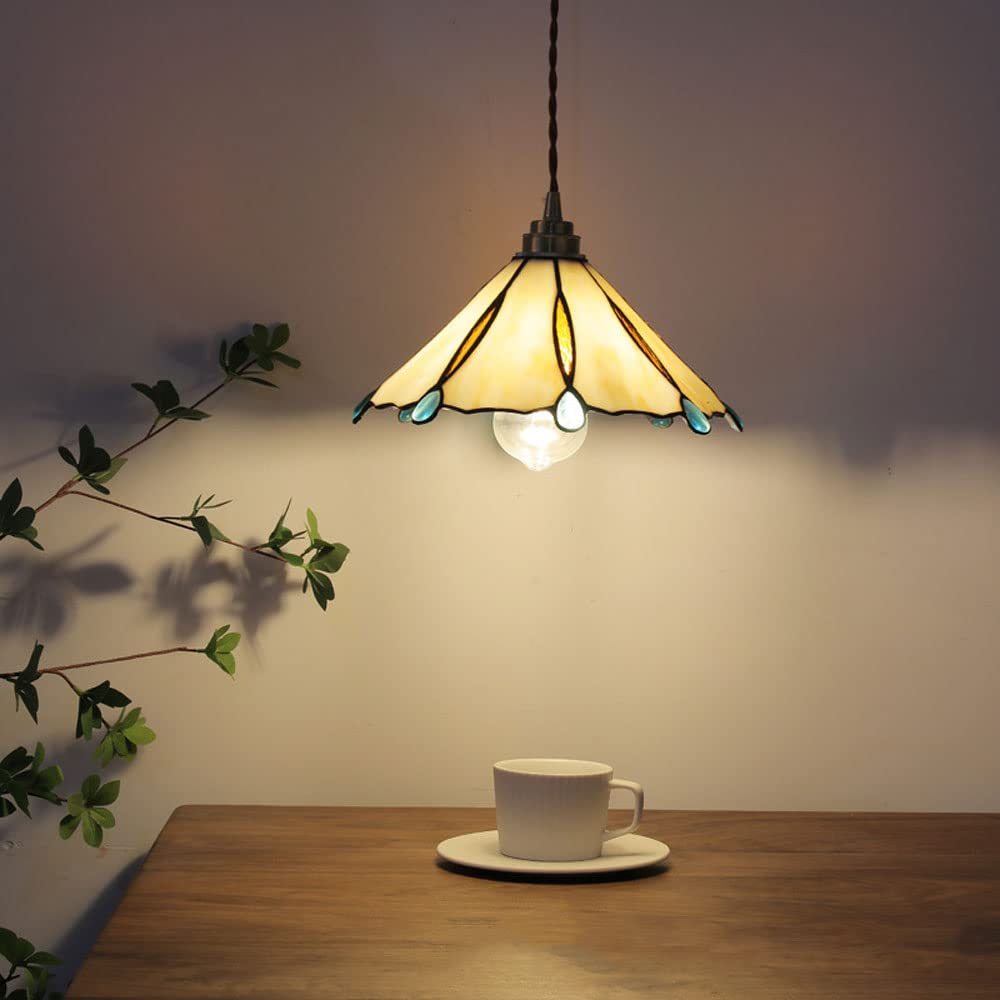 Eryn Vintage Pendant Light illuminating a cozy space with cup