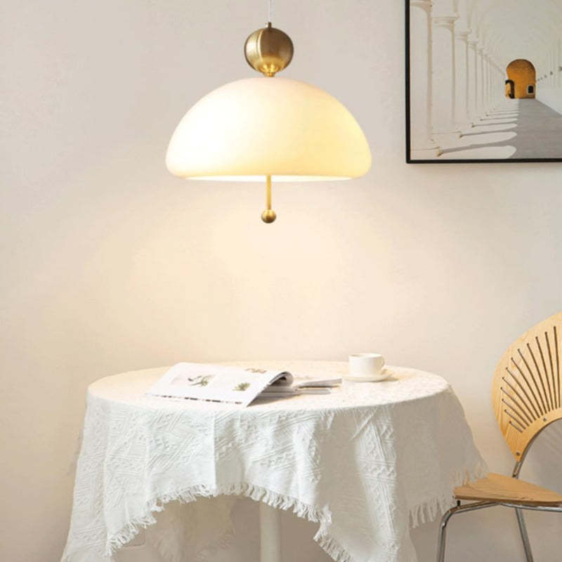 Morandi pendant light illuminates dining table