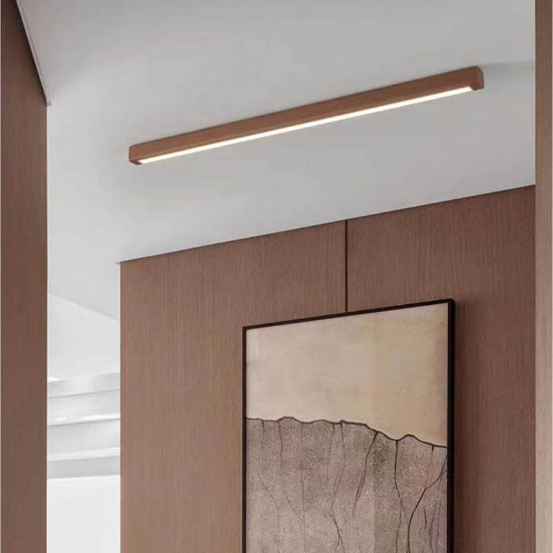 Modern Edge Linear Wood Ceiling Light in entryway.