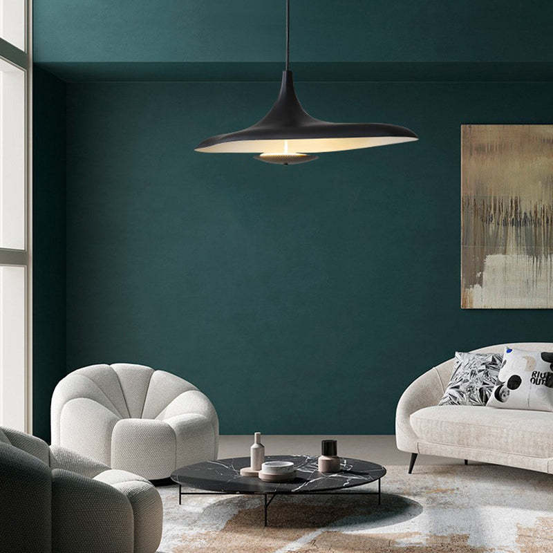Carins black pendant light in a modern living room setting
