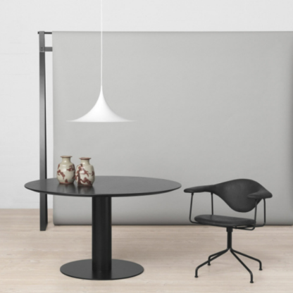 Cairns pendant light above a round black table