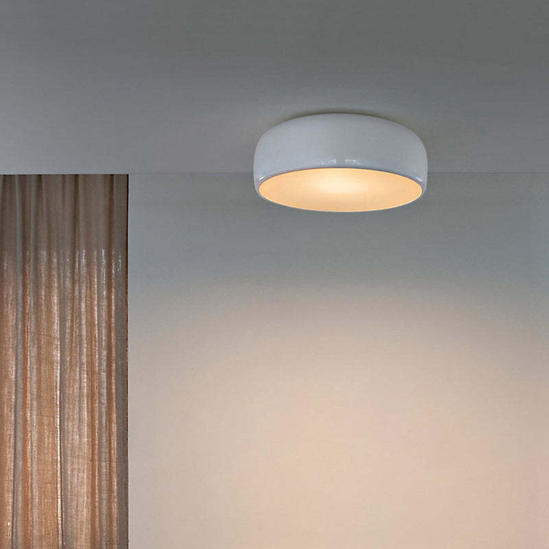 Modern white Leilani disc ceiling light in a room, illuminating