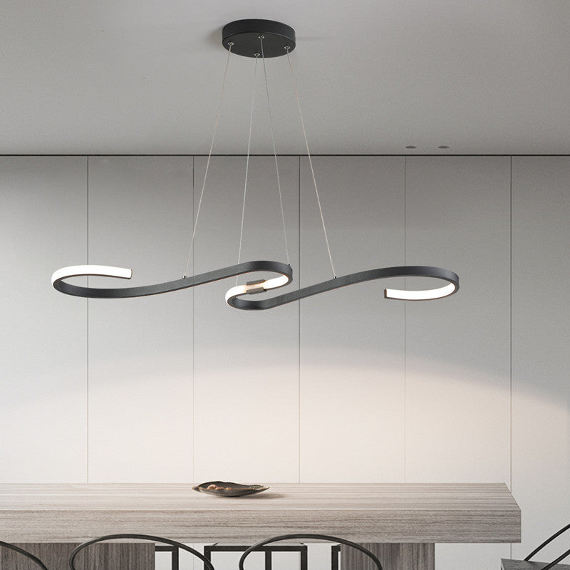Black Louise linear pendant light over dining table.