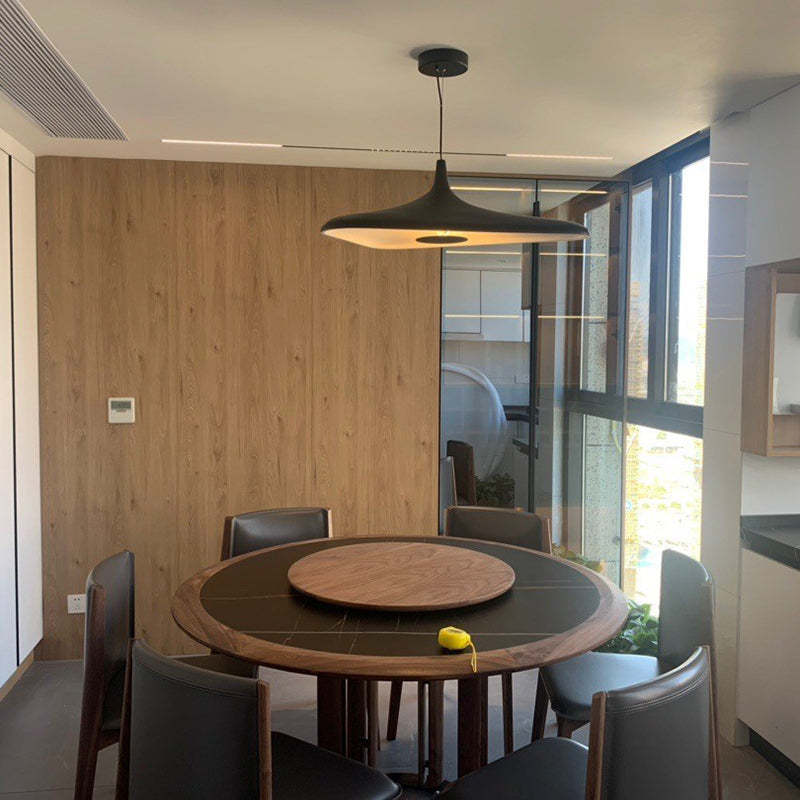 Carins black pendant light above dining table