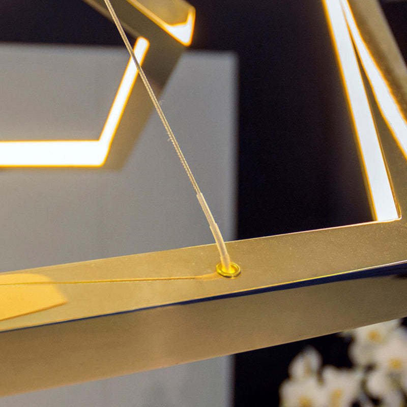 Close-up of gold geometric pendant light fixture details
