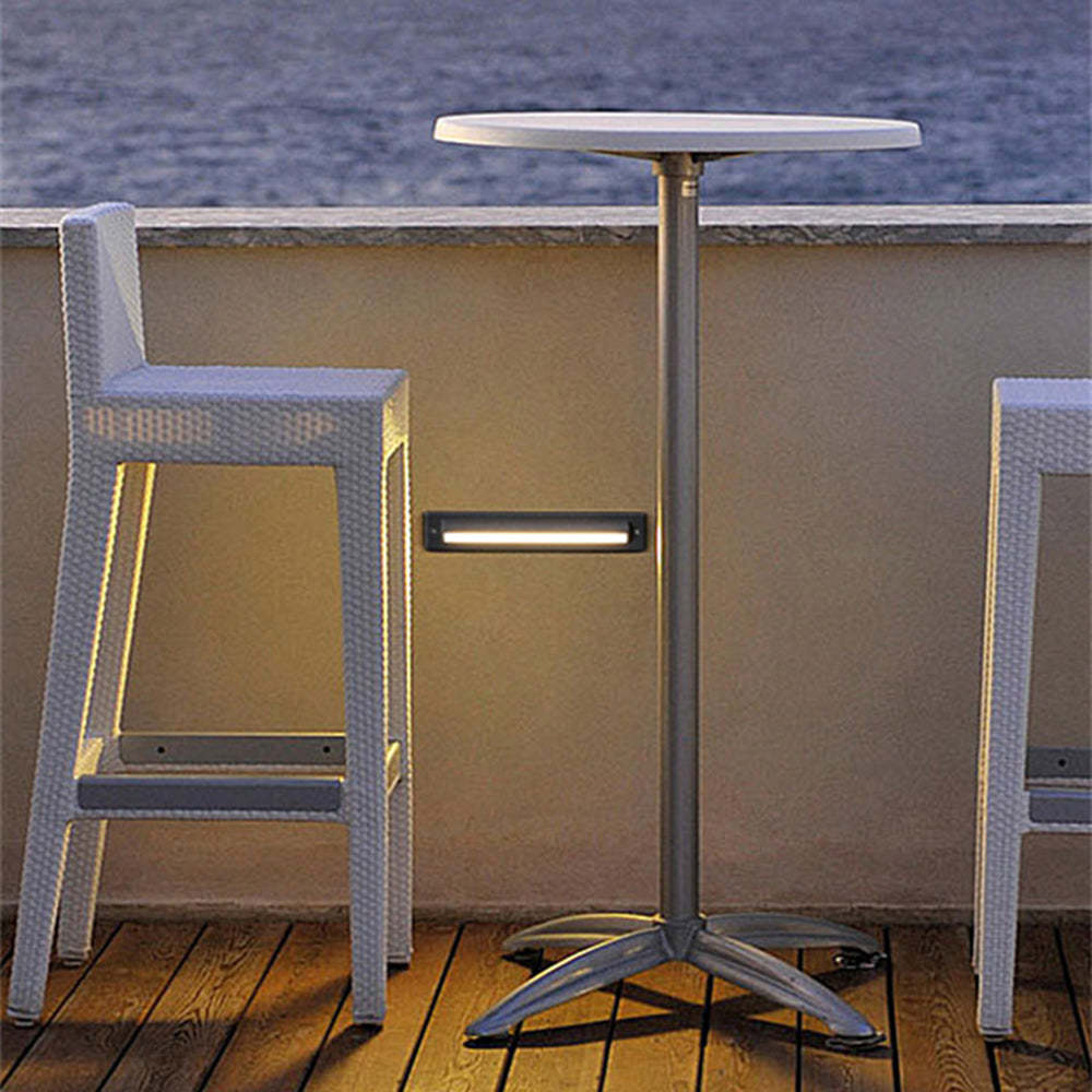 Orr outdoor step light illuminating outdoor seating area