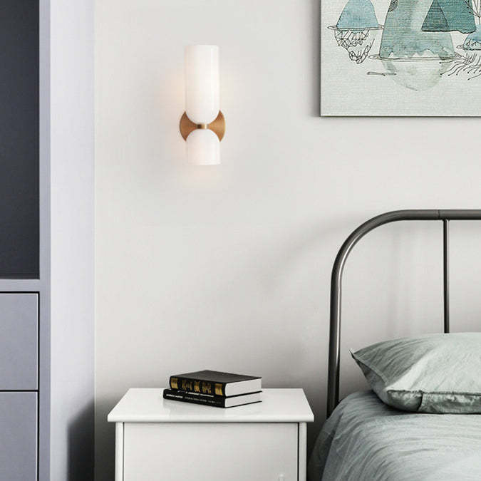 Modern glass wall sconce Hailie in bedroom setting