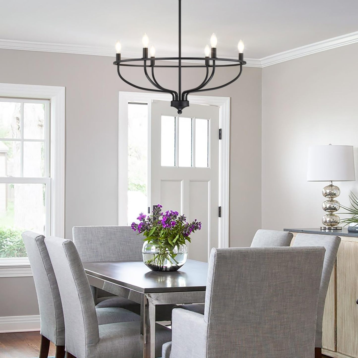 Black Silva chandelier over dining table, modern dining room