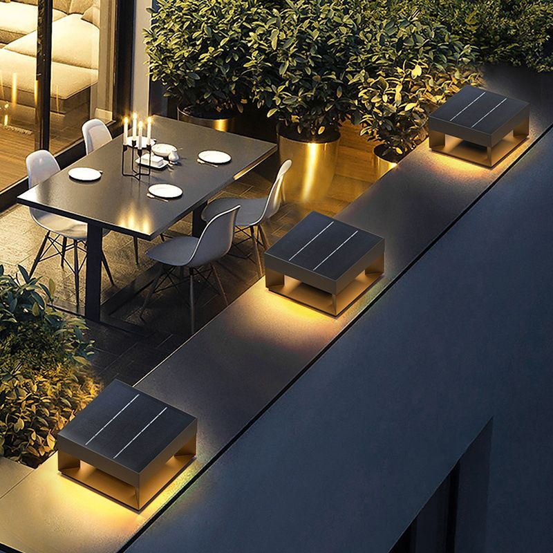 Riley solar square outdoor light on modern patio.