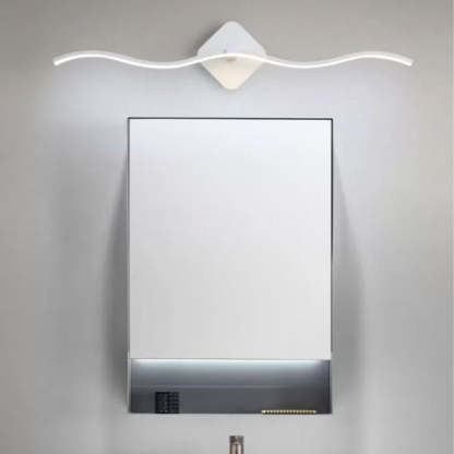 Louise Wave Wall Lamp above bathroom mirror.