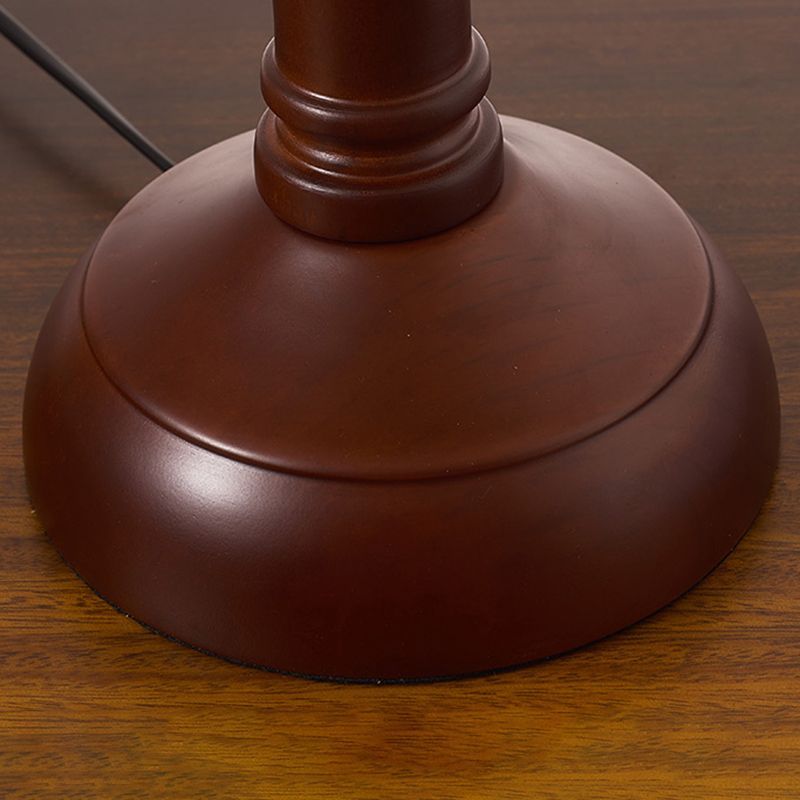 Retro table lamp base detail, brown metal finish.