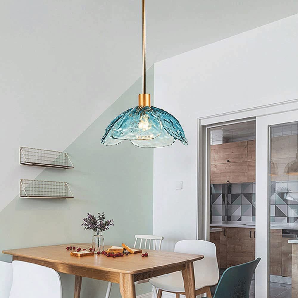 Hailie pendant light illuminating a dining room setting