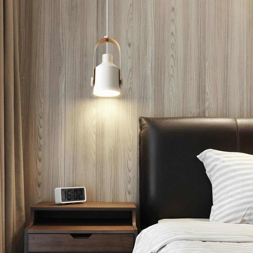 Morandi pendant light illuminates bedroom with wood accent and digital clock