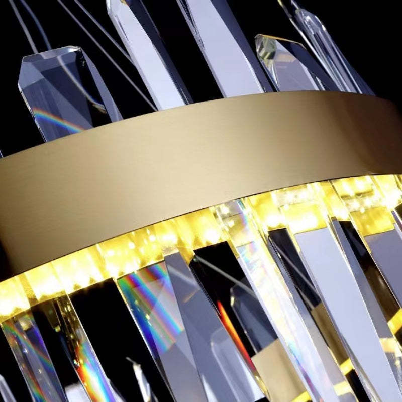 Close-up of Marylin Chandelier's crystal and brass detail.