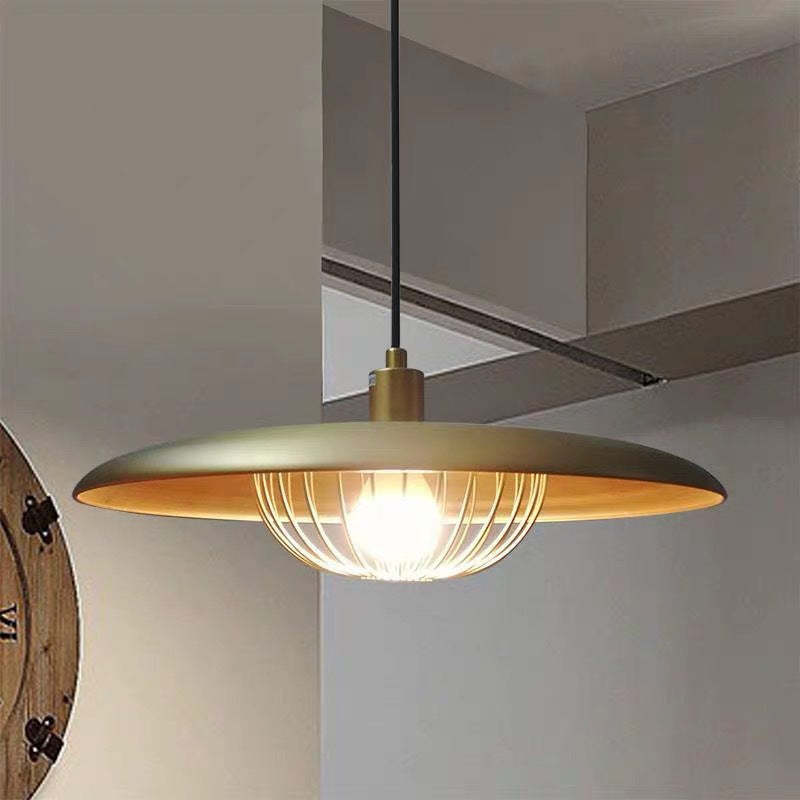 Gold Cairns metal pendant light in a modern interior.