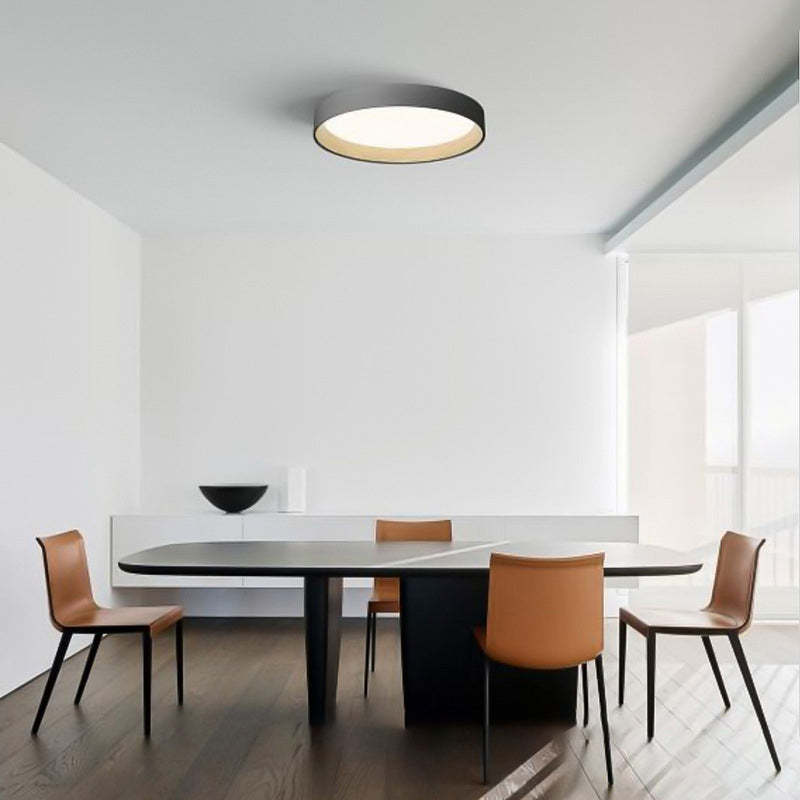 Quinn Modern Round Flush Mount Ceiling Light in a dining room setting