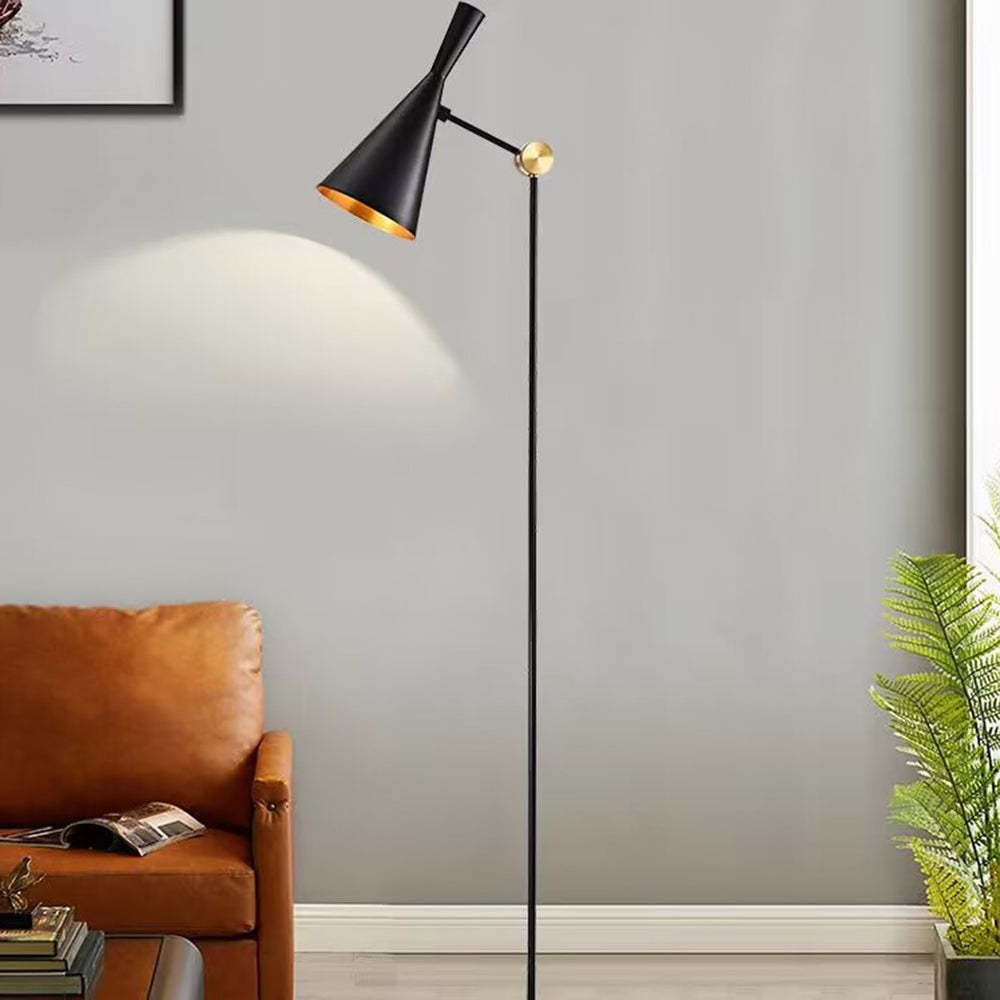 Black and gold Carins floor lamp illuminating a living room