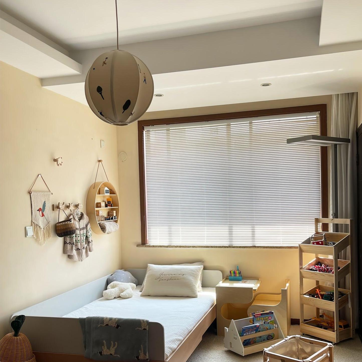 Ritta Globe Pendant Light in a cozy bedroom setting