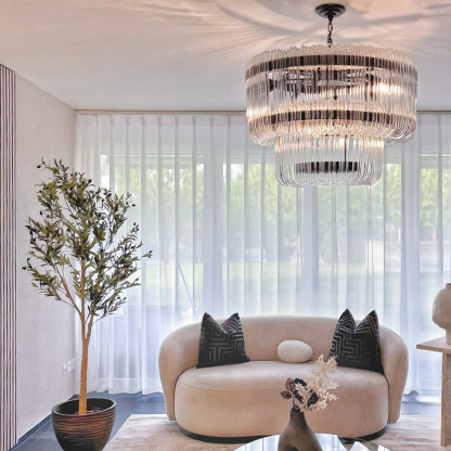 Marilyn Chandelier illuminating a modern living room