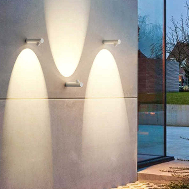 Orr modern outdoor wall lamps illuminating concrete wall, modern design