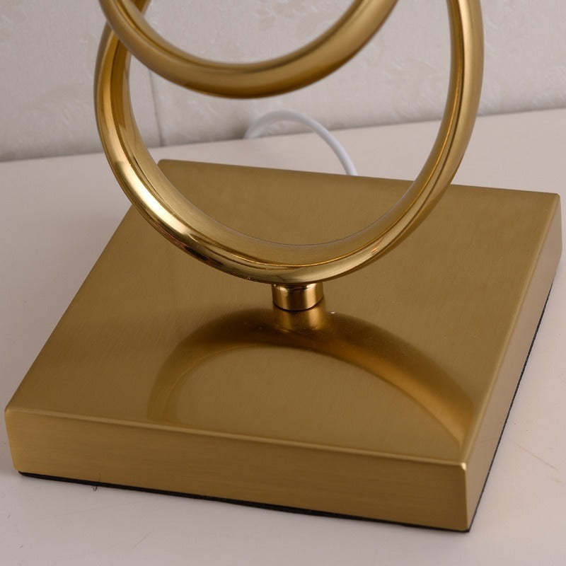 Gold metal lamp base and loops, Lassola Sano series