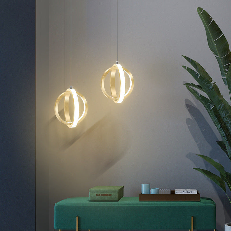 Modern spherical pendant lights over green bench
