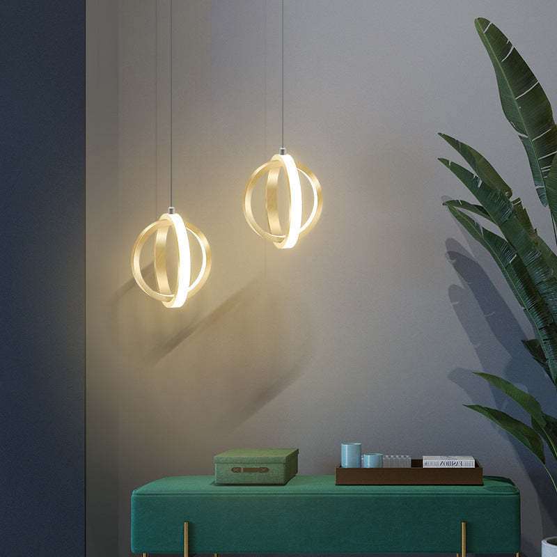Modern spherical pendant lights over green bench