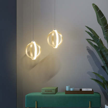 Modern spherical pendant lights over green bench