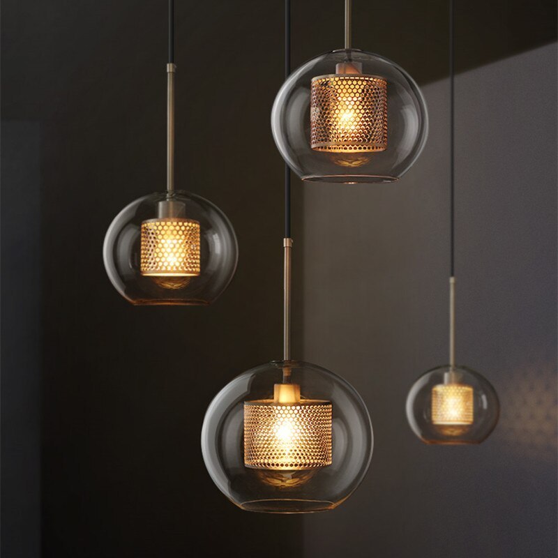 Contemporary pendant lights with warm light and metallic accents