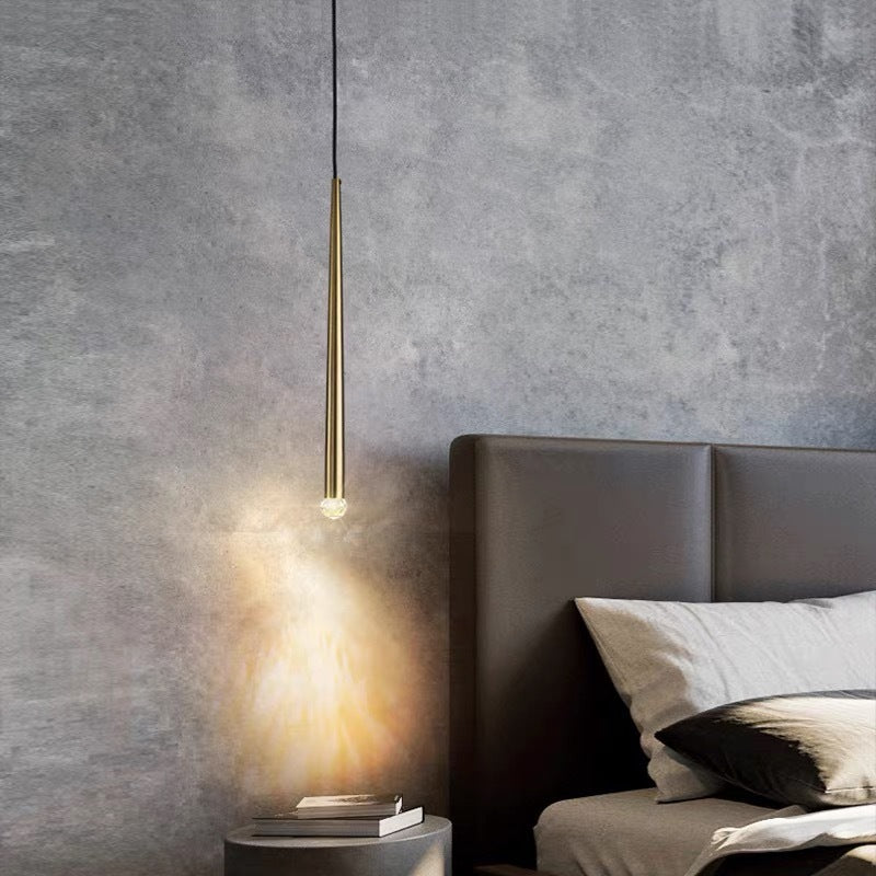 Modern gold pendant light in bedroom. Carr lighting fixture
