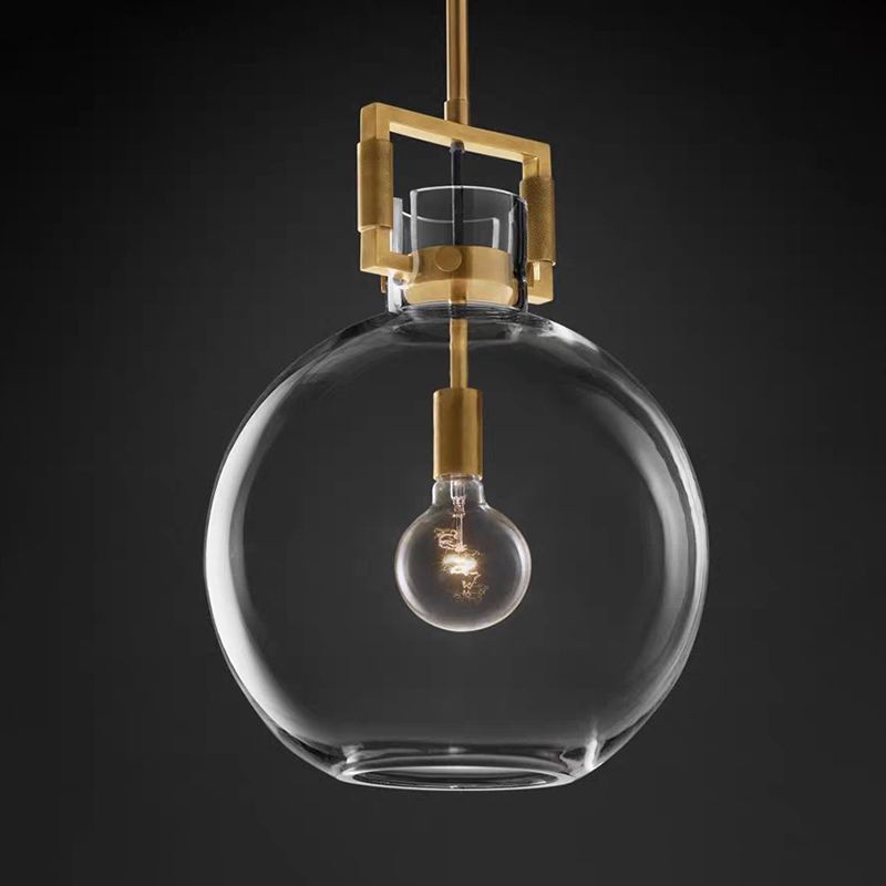 Cairns geometric pendant light. Brass & glass fixture.