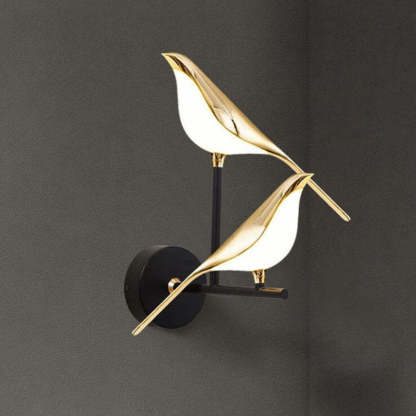 Clifford Magpie wall light in gold for bedroom.