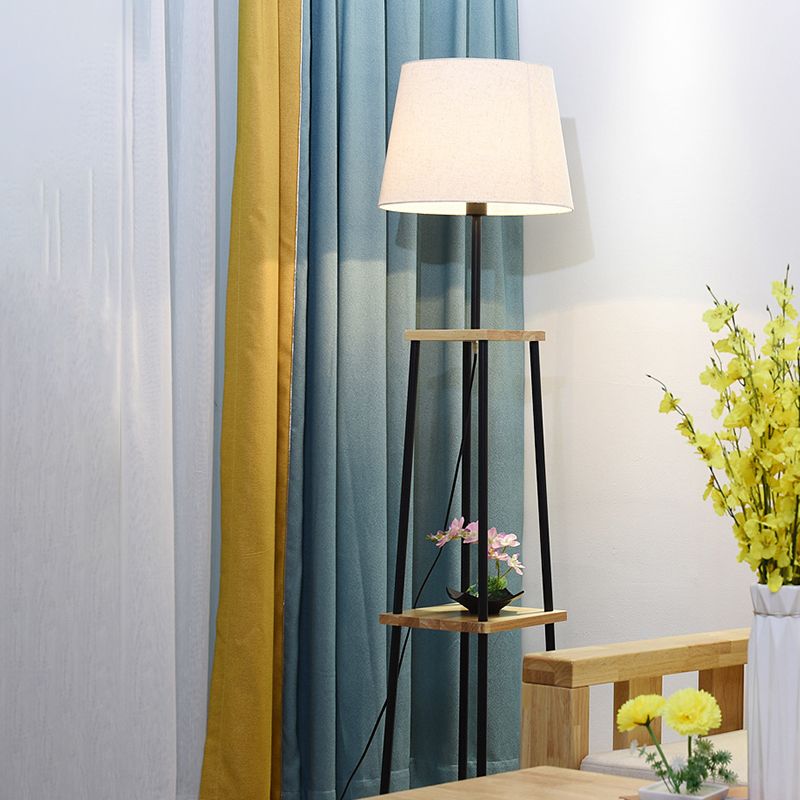 Eryn floor lamp: fabric shade & shelves for decor.