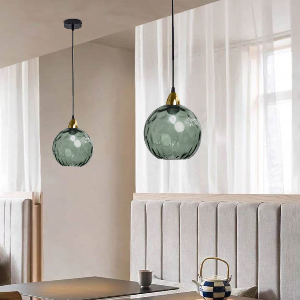 Gray Hailie glass pendant lights in dining room. Modern lighting.