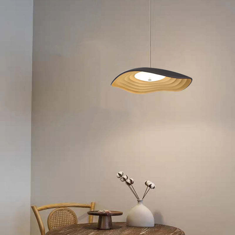 Carins Wabi-Sabi pendant light over round dining table
