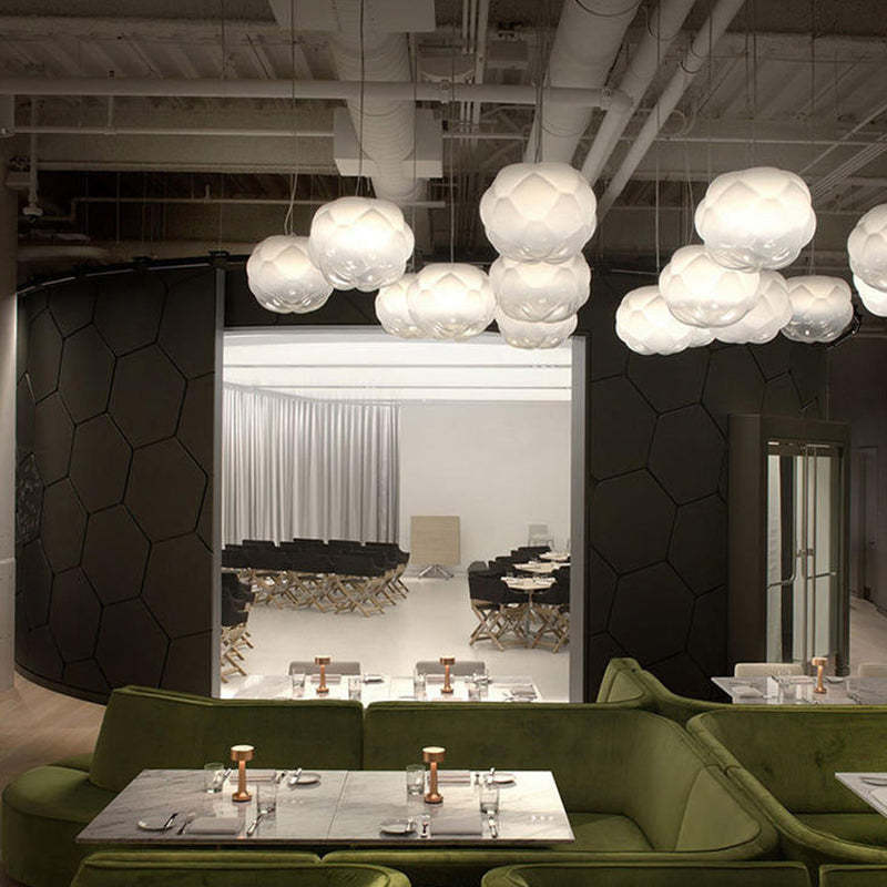 Cloud-shaped pendant lights in a modern restaurant setting