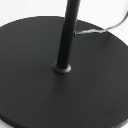 Avi Floor Lamp: Black metal base detail.