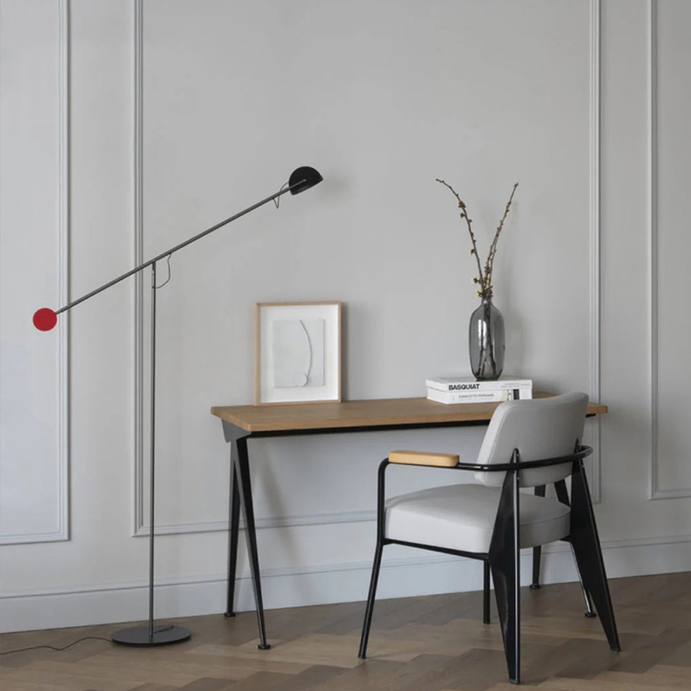 Avi Industrial minimalist floor lamp near desk with Basquiat book.