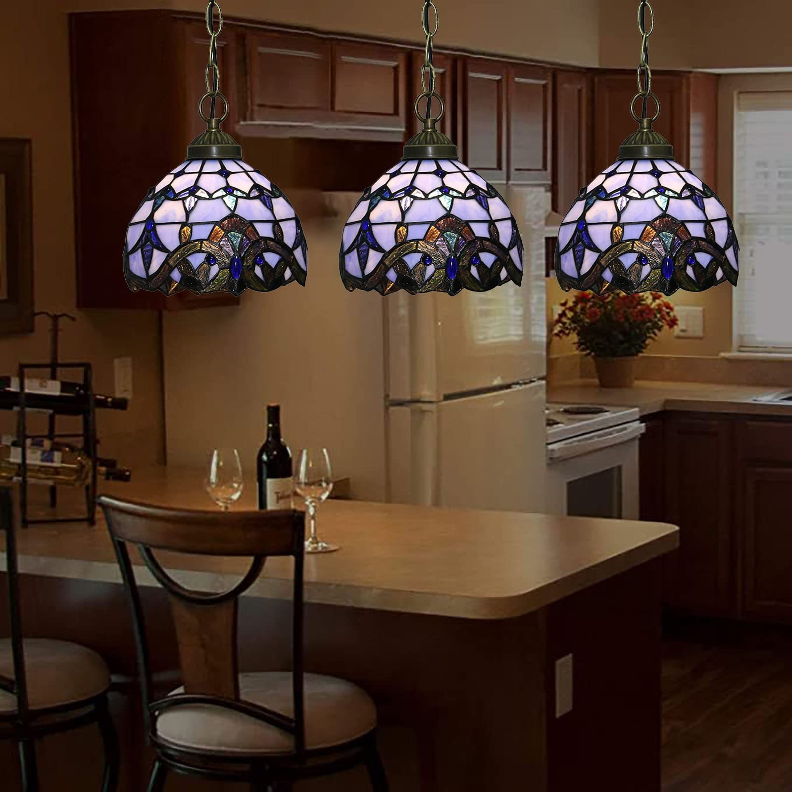 Purple pendant lights in kitchen over island