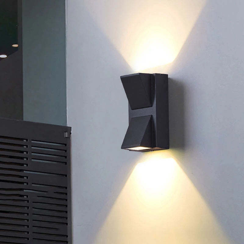 Orr Modern Metal LED Outdoor Wall Lamp illuminating a wall.