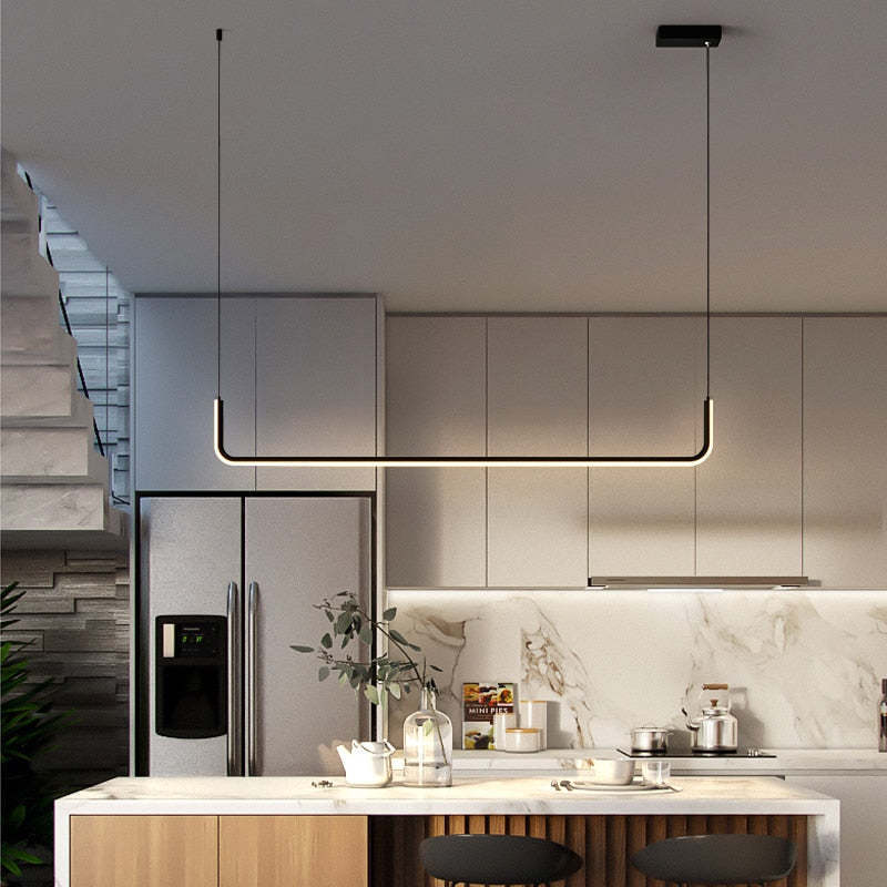 Modern linear pendant light above kitchen island.