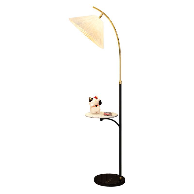 Ozawa pleated floor lamp with side table and cat figurine.