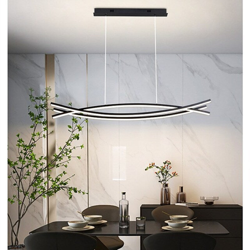 Louise modern linear pendant light above dining table.