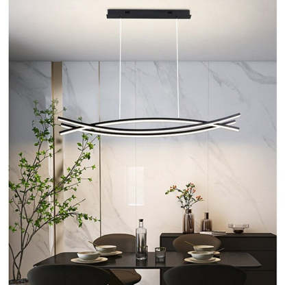 Louise modern linear pendant light above dining table.